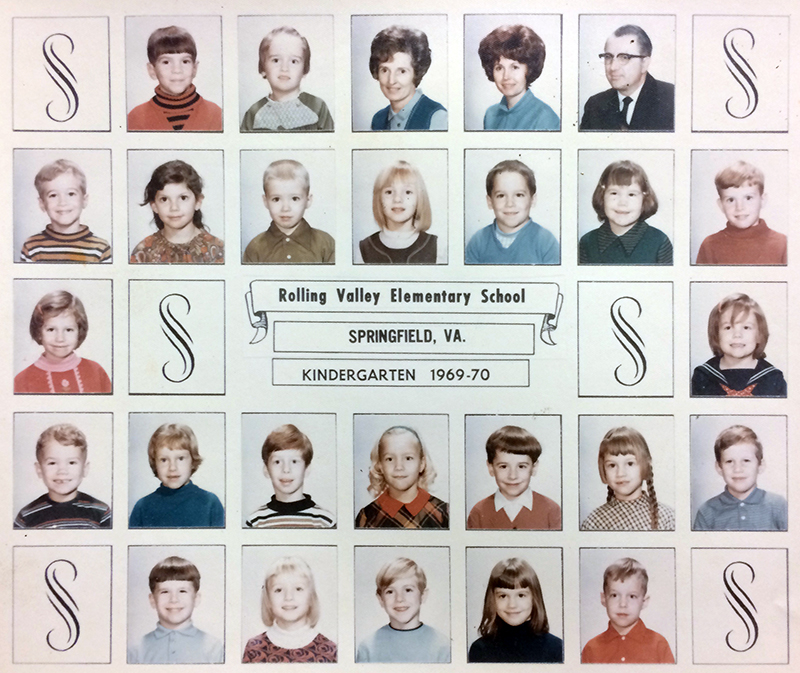 Color class photograph showing a kindergarten classroom during the 1969 to 1970 school year. Principal Mitchell and two other adults are shown. 23 children are pictured, an even mix of boys and girls, all are Caucasian. 
